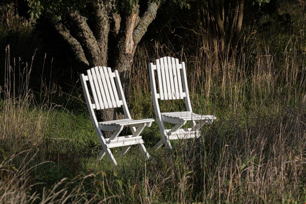 An image of two chairs together symbolising dialogue.
