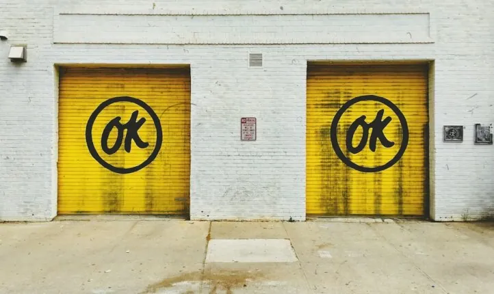 Okness - image of two doors bearing the word OK, symbolising the 'I'm OK, You're OK' approach in coaching.