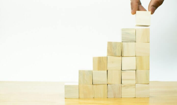 Coaching statistics (image of a bar chart made of building blocks)